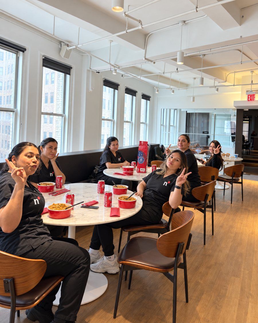The Nomad Facilities service team taking a lunch break together in a client's office